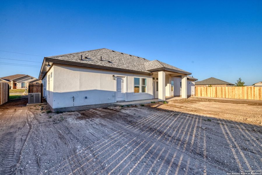 Exterior details and patio area of a home in , Uvalde (Image 26).