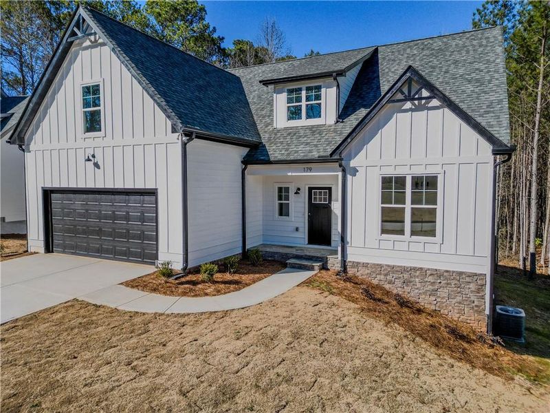 Front exterior of a new home in , Villa Rica, GA, highlighting curb appeal (Image 1). Front exterior of a new home in , Villa Rica, GA, highlighting curb appeal (Image 1).