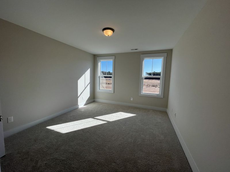 Spacious, unfurnished interior of a new home in River Tide Farms, Bolivia (Image 20).