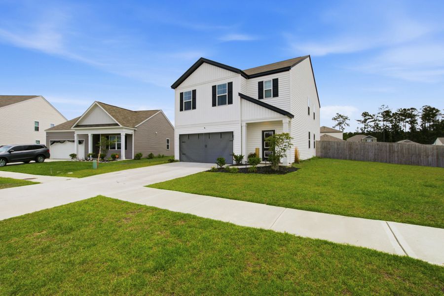 Front exterior of a new home in , Summerville, SC, highlighting curb appeal (Image 23). Front exterior of a new home in , Summerville, SC, highlighting curb appeal (Image 23).