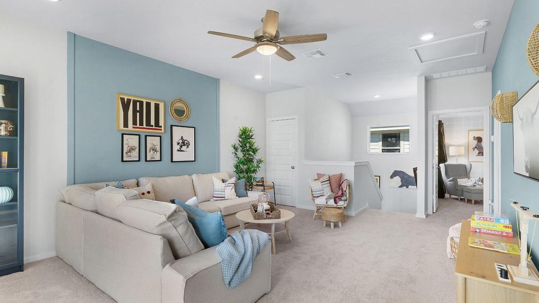 A versatile secondary living space features a cozy seating area with soft carpeting and gentle recessed lighting. A versatile secondary living space features a cozy seating area with soft carpeting and gentle recessed lighting.