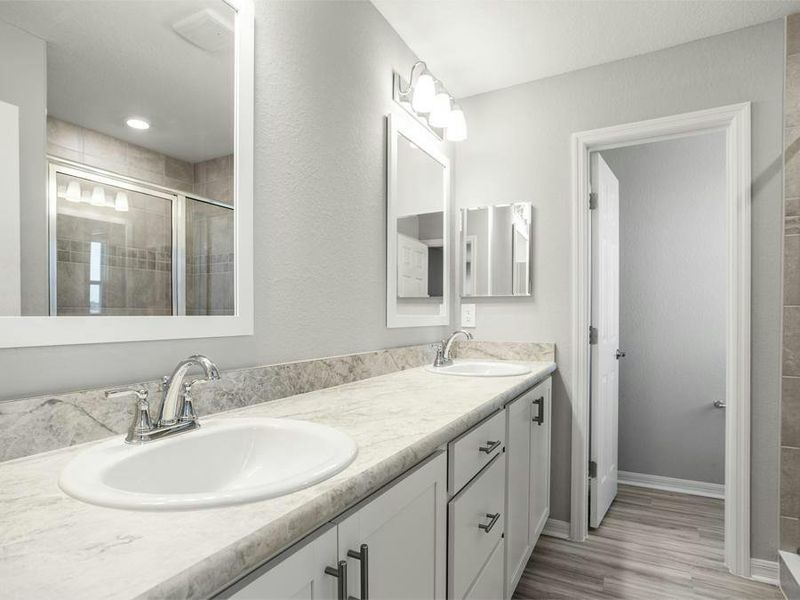 Your suite is complete with a walk-in wardrobe and a private en-suite bath with a tiled shower.