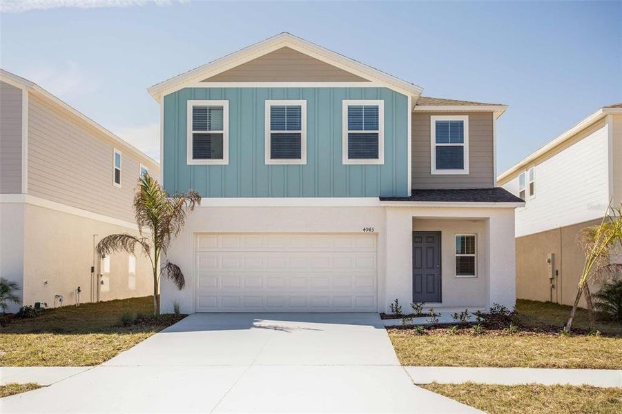 Front exterior of a new home in Wynnstone, Davenport, FL, highlighting curb appeal (Image 1).