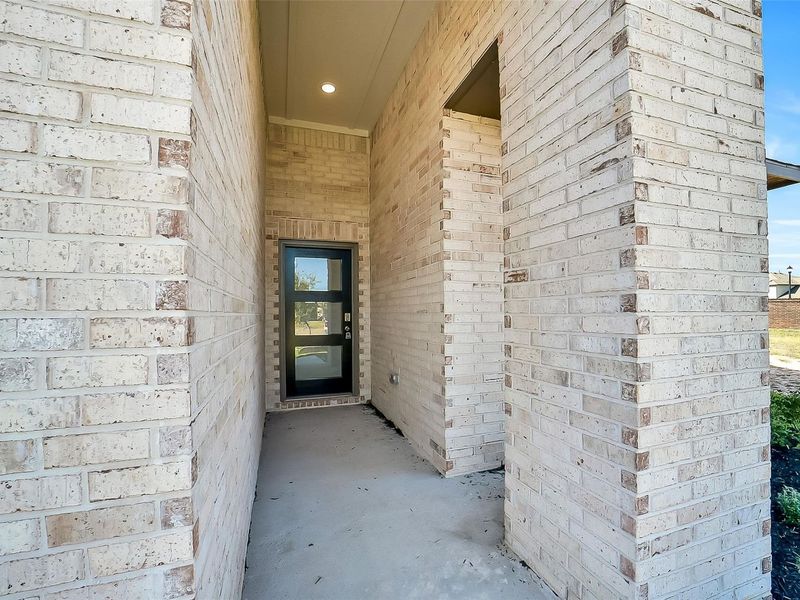 Exterior details and patio area of a home in Sunterra, Katy (Image 3).
