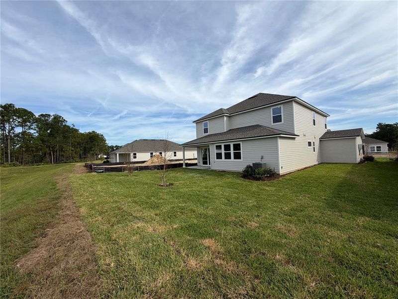 Exterior details and patio area of a home in The Cypress Series at Reserve East, Flagler Beach (Image 26).