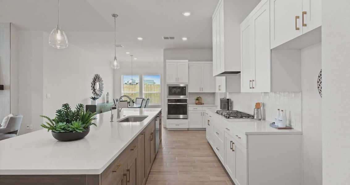 Representative furnished interior of a home built from the Maddie by Chesmar Homes in Buffalo Crossing, Cibolo (Image 4).