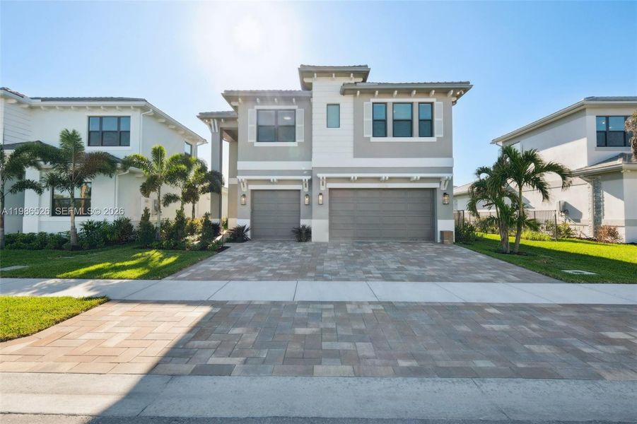 Front exterior of a new home in , Palm Beach Gardens, FL, highlighting curb appeal (Image 27).