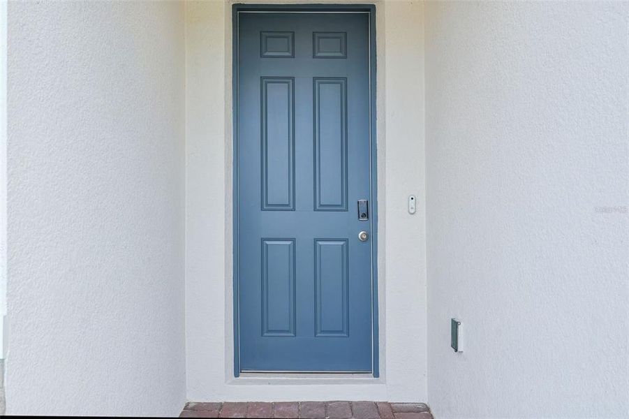 Exterior details and patio area of a home in The Reserve at Twin Lakes, St. Cloud (Image 4).