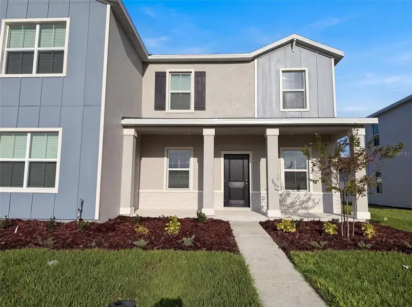 Front exterior of a new home in , Apopka, FL, highlighting curb appeal (Image 2). Front exterior of a new home in , Apopka, FL, highlighting curb appeal (Image 2).