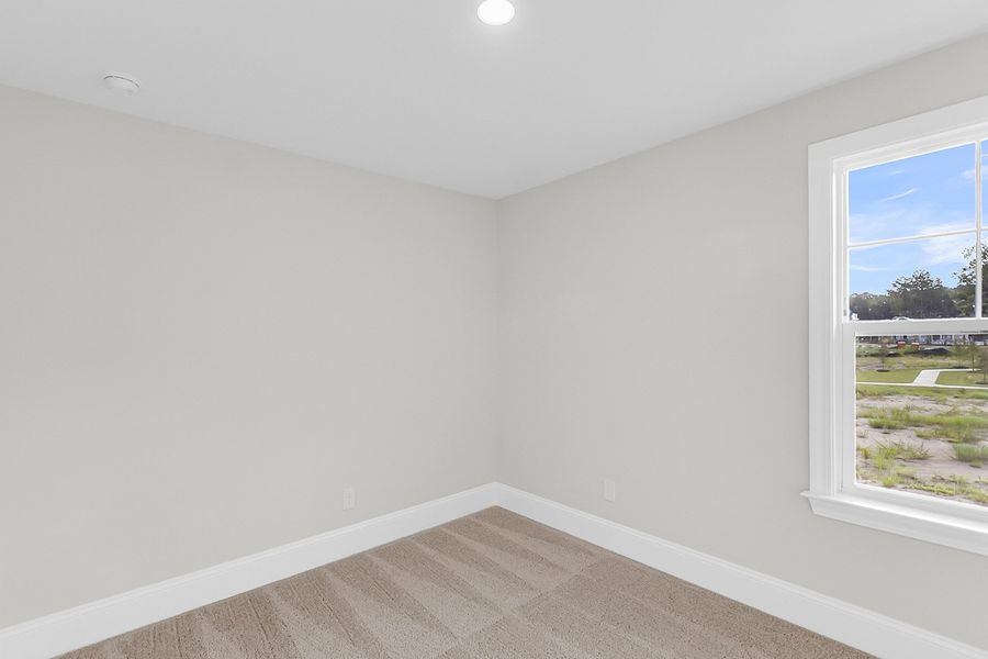 Spacious, unfurnished interior of a new home in Pineland Preserve, Summerville (Image 37).