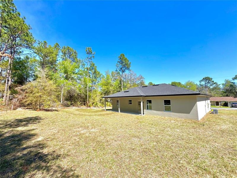 Exterior details and patio area of a home in , Citrus Springs (Image 19).