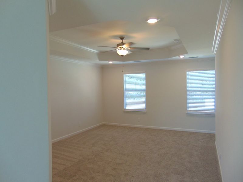 The primary bedroom, is on the second floor and has tray ceilings The primary bedroom, is on the second floor and has tray ceilings