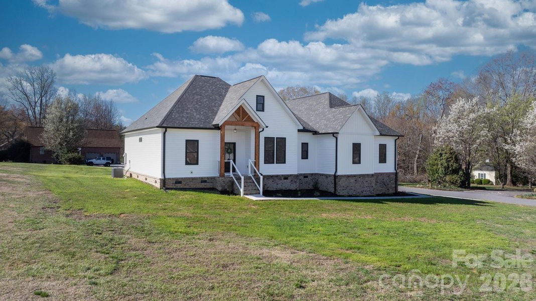 Front exterior of a new home in , Conover, NC, highlighting curb appeal (Image 29).