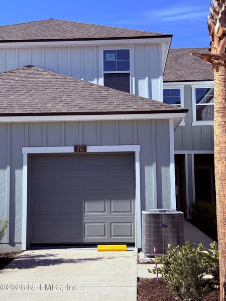 Front exterior of a new home in Liberty Cove, Yulee, FL, highlighting curb appeal (Image 2).