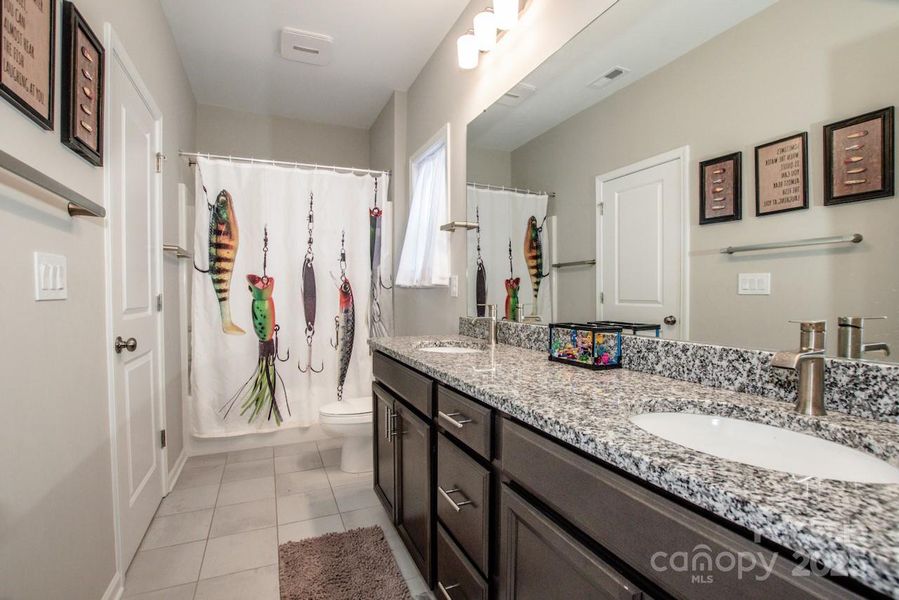 Furnished interior view inside a new home in Signature at Reid's Cove, Mooresville (Image 26).
