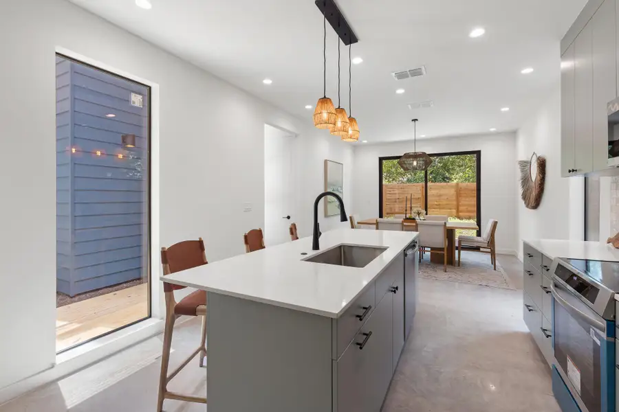 The well-proportioned kitchen provides plenty of space for meal preparation and conversation. The well-proportioned kitchen provides plenty of space for meal preparation and conversation.