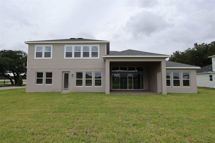 Exterior details and patio area of a home in Solace at Corner Lake, Orlando (Image 17).