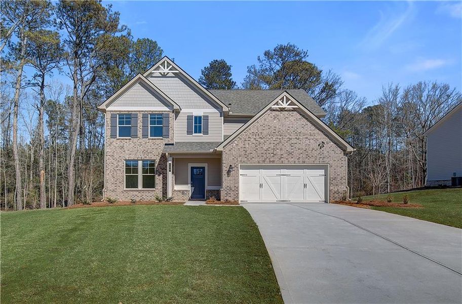 Front exterior of a new home in Copperfield, Locust Grove, GA, highlighting curb appeal (Image 1).