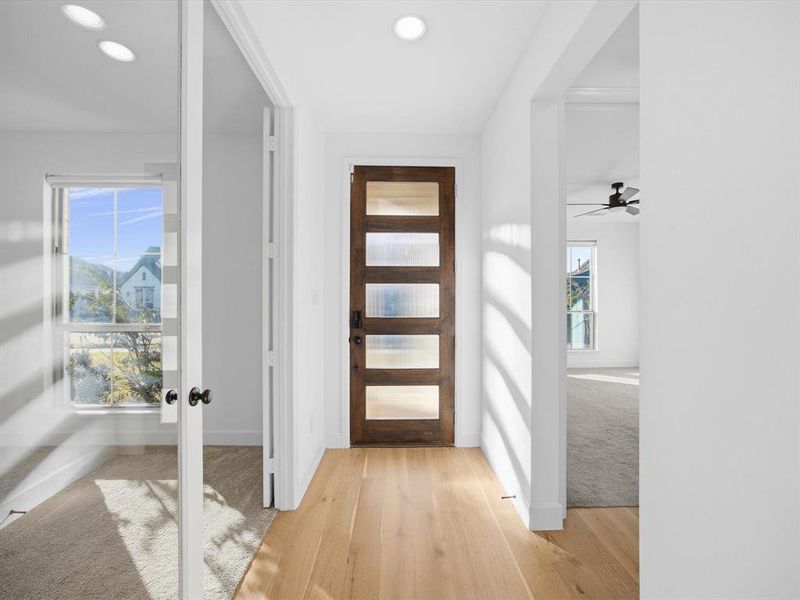 Foyer featuring healthy amount of natural light, light wood finished floors, french doors, recessed lighting, and a ceiling fan Foyer featuring healthy amount of natural light, light wood finished floors, french doors, recessed lighting, and a ceiling fan