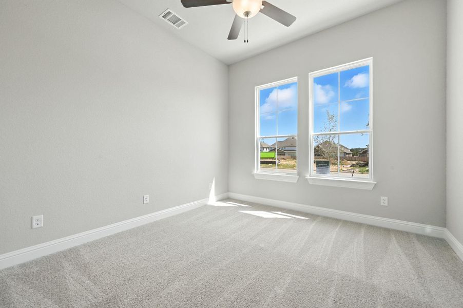 Unfurnished room with carpet and ceiling fan