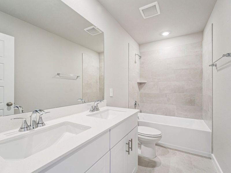 Furnished interior view inside a new home in Granger Pointe - Premier Series, Conroe (Image 11).