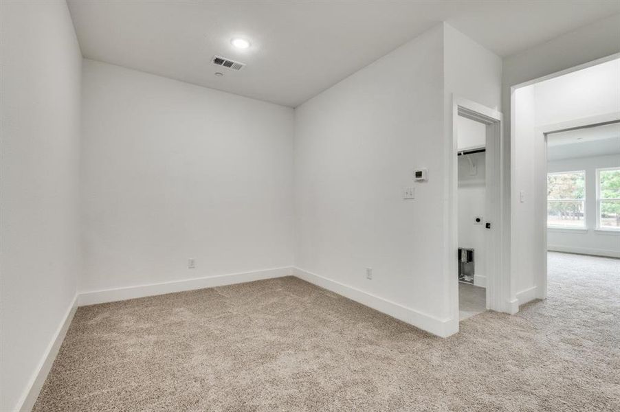 View of carpeted spare room