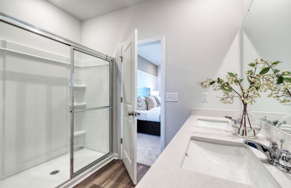 Enjoy a rejuvenate spa experience in the Owner's Bath walk-in shower.
