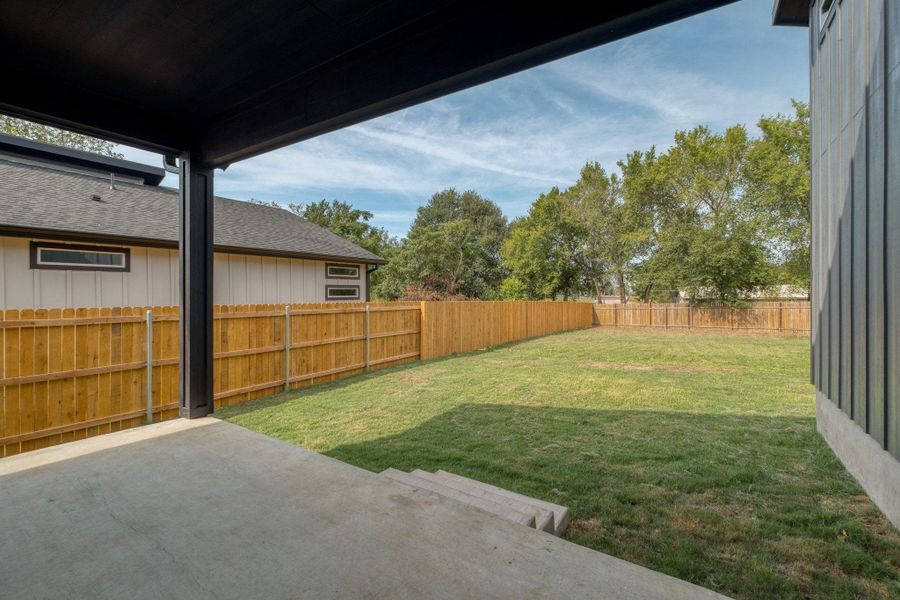 Fenced backyard featuring a patio Fenced backyard featuring a patio