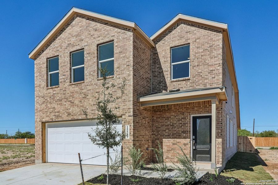 Front exterior of a new home in Summerlin: Eventide Collection, San Antonio, TX, highlighting curb appeal (Image 26).