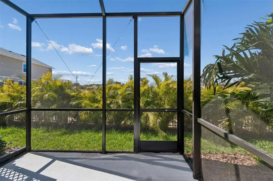 Exterior details and patio area of a home in North River Ranch – Townhomes, Parrish (Image 31).