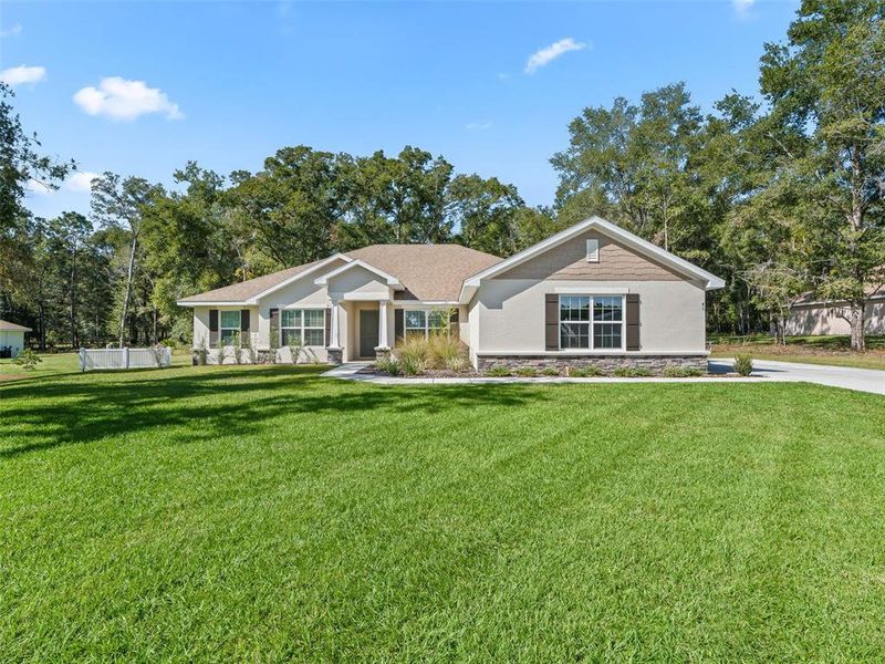 Front exterior of a new home in Dorchester, Ocala, FL, highlighting curb appeal (Image 21).
