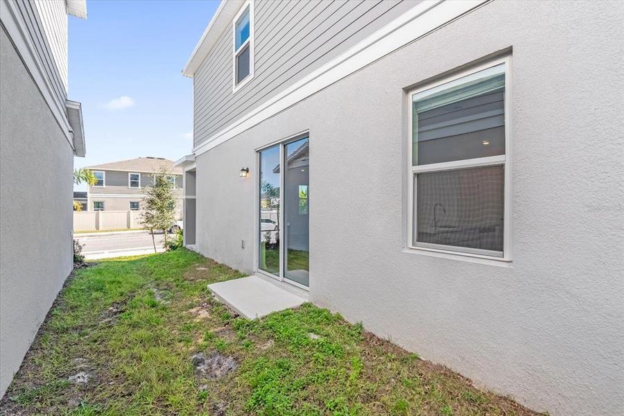 Exterior details and patio area of a home in Bellaviva III at Westside, Davenport (Image 3).