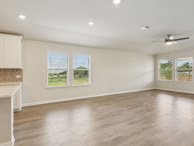 Dining and living room in the Oleander floorplan at a Meritage Homes community.