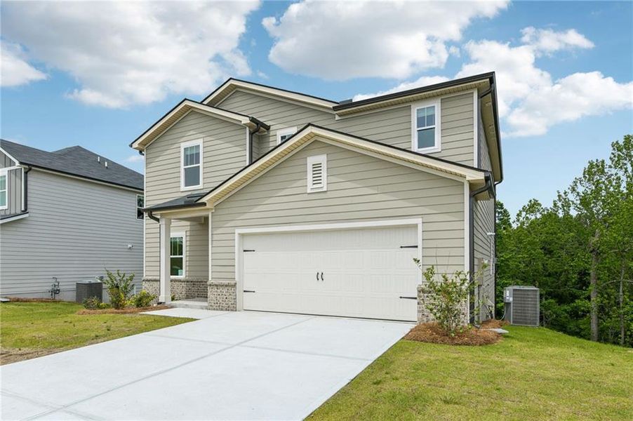 Front exterior of a new home in Ivey Township, Dallas, GA, highlighting curb appeal (Image 22).