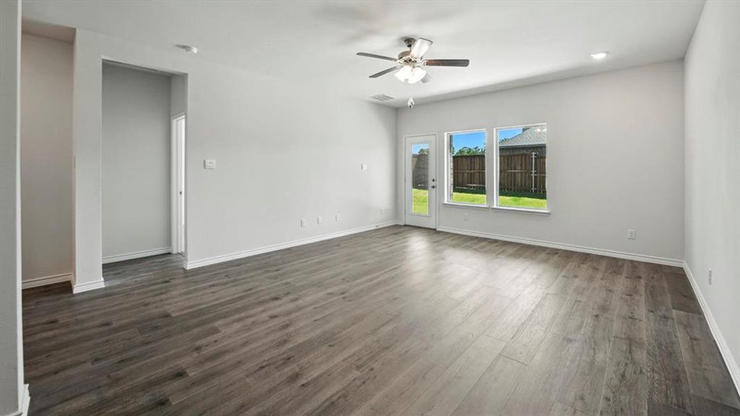 Spare room featuring dark wood-type flooring, ceiling fan, and recessed lighting Spare room featuring dark wood-type flooring, ceiling fan, and recessed lighting