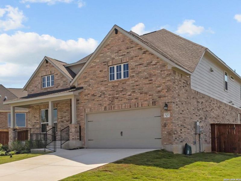 Front exterior of a new home in Homestead, Schertz, TX, highlighting curb appeal (Image 2). Front exterior of a new home in Homestead, Schertz, TX, highlighting curb appeal (Image 2).