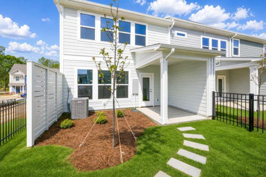 Exterior details and patio area of a home in North Creek Village - Townhomes, Huntersville (Image 3). Exterior details and patio area of a home in North Creek Village - Townhomes, Huntersville (Image 3).