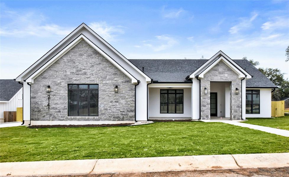Front exterior of a new home in , Fredericksburg, TX, highlighting curb appeal (Image 2). Front exterior of a new home in , Fredericksburg, TX, highlighting curb appeal (Image 2).