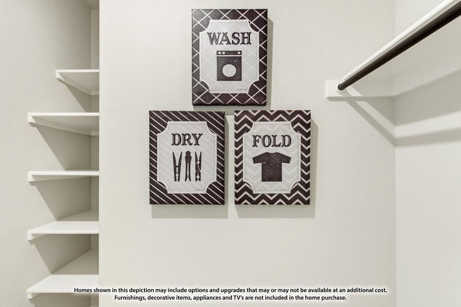 Laundry room wall with three decorative signs reading Wash, Dry, and Fold, with white open shelving on the left. Laundry room wall with three decorative signs reading Wash, Dry, and Fold, with white open shelving on the left.