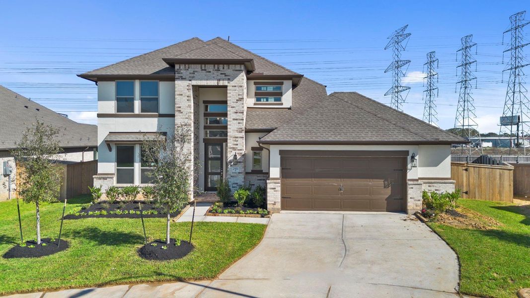 Front exterior of a new home in Coastal Point, League City, TX, highlighting curb appeal (Image 20).