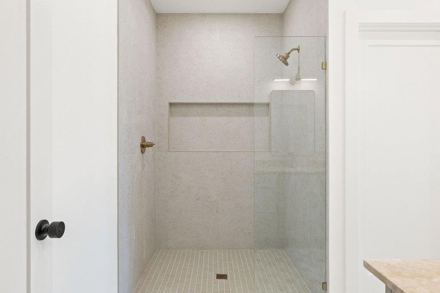 Bathroom featuring a shower stall