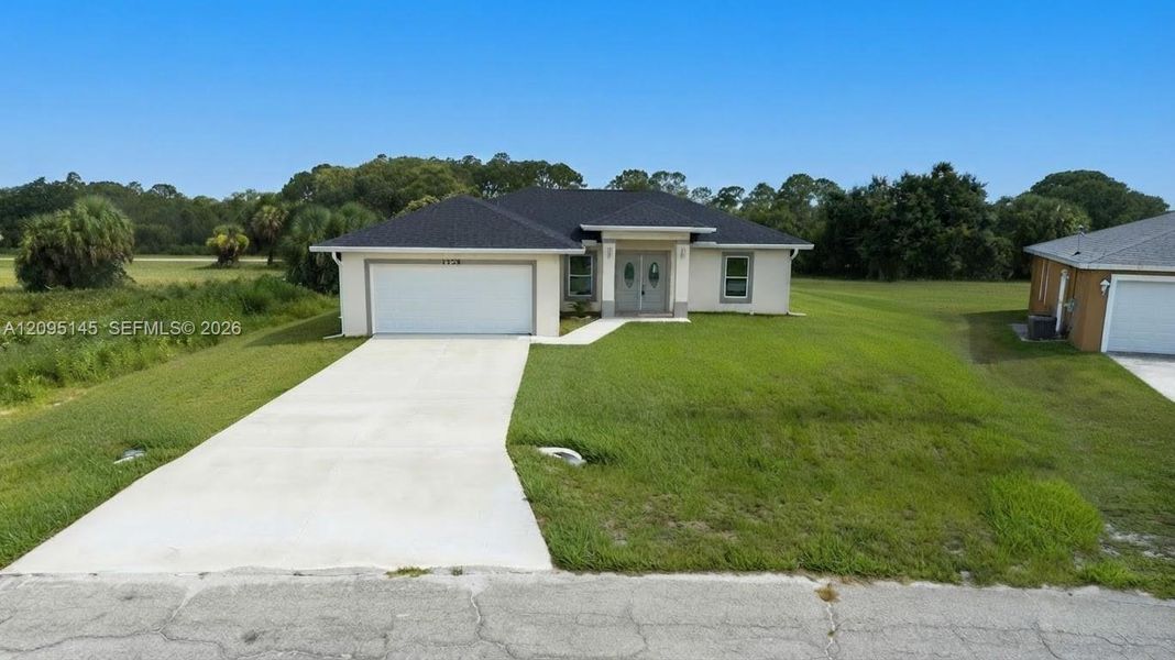 Front exterior of a new home in , Labelle, FL, highlighting curb appeal (Image 25). Front exterior of a new home in , Labelle, FL, highlighting curb appeal (Image 25).