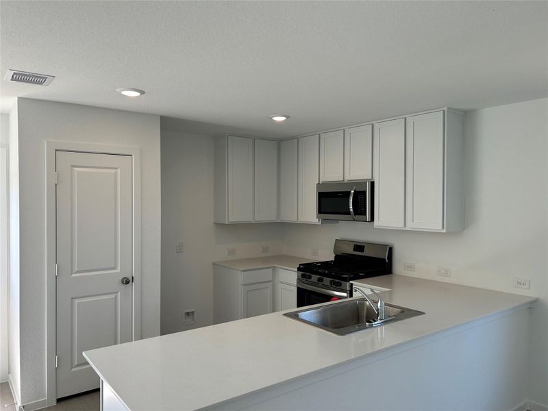 Furnished interior view inside a new home in Sweetgrass Village: Cottage Collection, Crosby (Image 7).