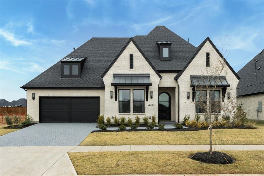 Front exterior of a new home in , Prosper, TX, highlighting curb appeal (Image 2). Front exterior of a new home in , Prosper, TX, highlighting curb appeal (Image 2).