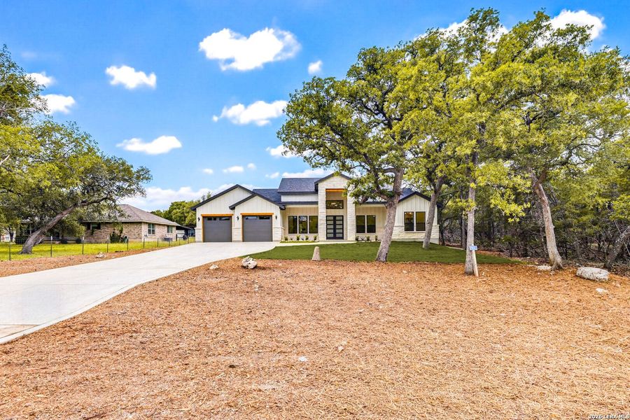 Front exterior of a new home in , Boerne, TX, highlighting curb appeal (Image 24).