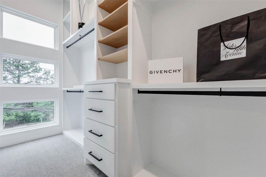 Wardrobe windows flood the space with natural light.