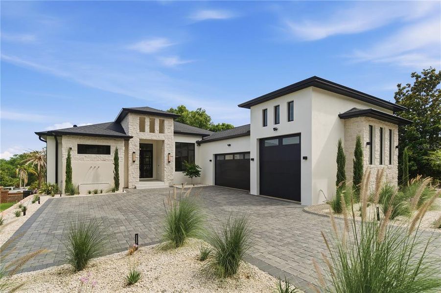 Front exterior of a new home in , Clermont, FL, highlighting curb appeal (Image 2). Front exterior of a new home in , Clermont, FL, highlighting curb appeal (Image 2).