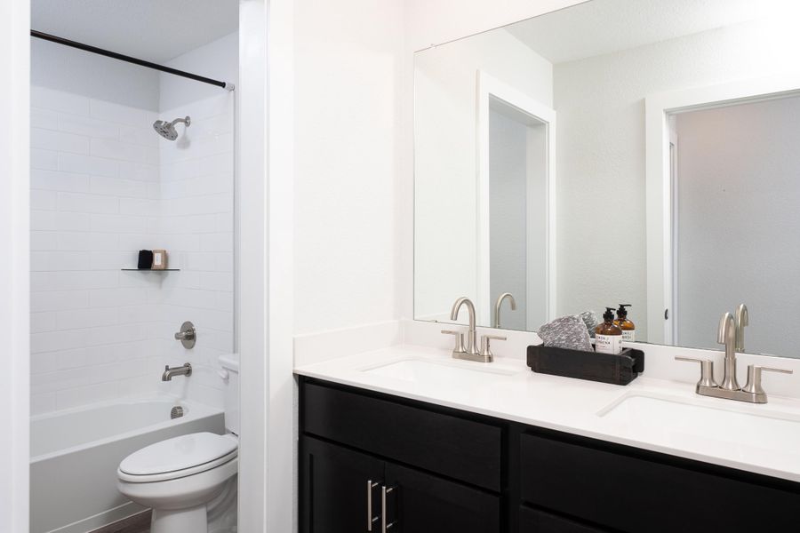 Representative furnished interior of a home built from the Sage by Tri Pointe Homes in Union Park, Little Elm (Image 11).