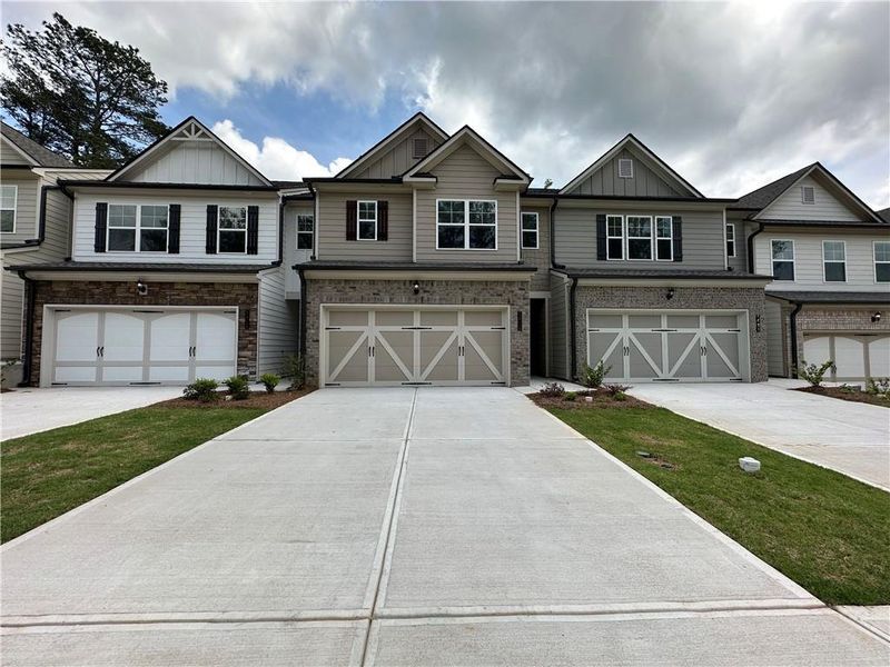 Front exterior of a new home in Mulberry Summit, Flowery Branch, GA, highlighting curb appeal (Image 1).