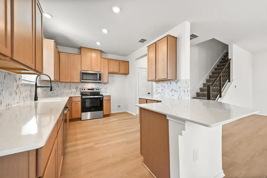 Furnished interior view inside a new home in Creekside at Estancia, Austin (Image 6). Furnished interior view inside a new home in Creekside at Estancia, Austin (Image 6).